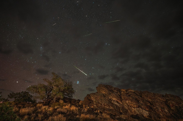 Meteors from the Perseids Meteor Shower streak across a partly cloudy sky above Inyo National Forest in Bishop, California, in 2024. 

CREDIT
NASA/Preston Dyches

_____
Fast Facts
Comet of Origin	109P/Swift-Tuttle
Radiant	Constellation Perseus
Active	July 17 to Aug. 23, 2025 (Peak night: Aug. 12-13)
Observed Under Dark Skies	About 25 meteors per hour
Meteor Velocity	37 miles (59 km) per second
____

The Comet

The pieces of space debris that interact with our atmosphere to create the Perseids originate from comet 109P/Swift-Tuttle. Swift-Tuttle takes 133 years to orbit the Sun once. It was Giovanni Schiaparelli who realized in 1865 that this comet was the source of the Perseids. Comet Swift-Tuttle last visited the inner solar system in 1992.
Comet Swift-Tuttle was discovered in 1862 by Lewis Swift and Horace Tuttle. Swift-Tuttle is a large comet: its nucleus is 16 miles (26 kilometers) across. (This is almost twice the size of the object hypothesized to have led to the demise of the dinosaurs.)
Their radiant – the point in the sky from which the Perseids appear to come – is the constellation Perseus. This is also where we get the name for the shower: Perseids. However, the constellation for which a meteor shower is named only serves to aid viewers in determining which shower they are viewing on a given night. The constellation is not the source of the meteors.

