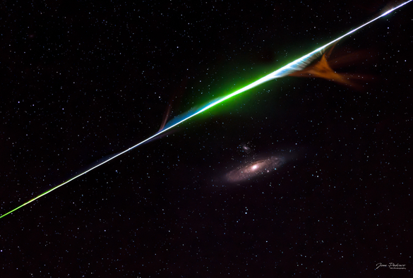 2023 August 23
A color meteor streak is seen above the Andromeda spiral galaxy. Please see the explanation for more detailed information.

The Meteor and the Galaxy
 * Credit & Copyright: Jose Pedrero

Explanation: 
It came from outer space. It -- in this case a sand-sized bit of a comet nucleus -- was likely ejected many years ago from Sun-orbiting Comet Swift-Tuttle, but then continued to orbit the Sun alone. When the Earth crossed through this orbit, the piece of comet debris impacted the atmosphere of our fair planet and was seen as a meteor. This meteor deteriorated, causing gases to be emitted that glowed in colors emitted by its component elements. The featured image was taken last week from Castilla La Mancha, Spain, during the peak night of the Perseids meteor shower. The picturesque meteor streak happened to appear in the only one of 50 frames that also included the Andromeda galaxy. Stars dot the frame, each much further away than the meteor. Compared to the stars, the Andromeda galaxy (M31) is, again, much further away. 

Authors & editors: Robert Nemiroff (MTU) & Jerry Bonnell (UMCP)
NASA Official: Phillip Newman Specific rights apply.
NASA Web Privacy Policy and Important Notices
A service of: ASD at NASA / GSFC,
NASA Science Activation
& Michigan Tech. U.