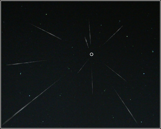 Image of a meteor shower, with the radiant marked by 'ᴏ'

CREDIT
Contributors of Wikimedia